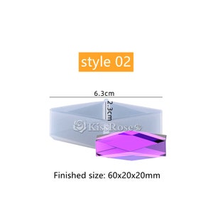 May include: A clear silicone mold for making a 60x20x20mm rectangular prism with a diamond-shaped cross-section. The mold is 6.3cm long and 2.3cm wide. The finished product is shown in purple.