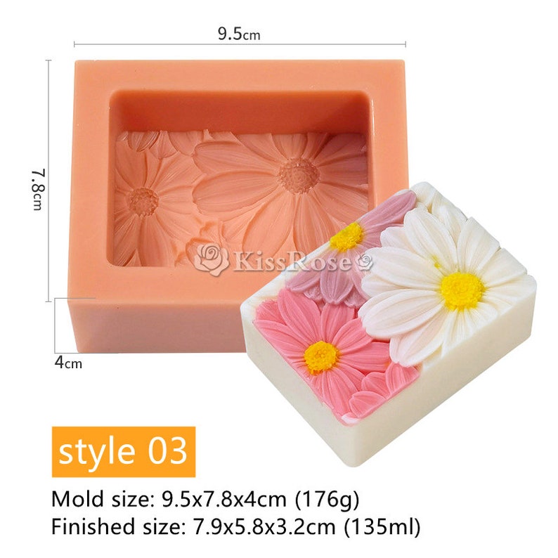 May include: A pink silicone mold for making soap with a daisy flower design. The mold measures 9.5 inches by 7.8 inches by 4 inches. A finished soap bar is shown next to the mold.