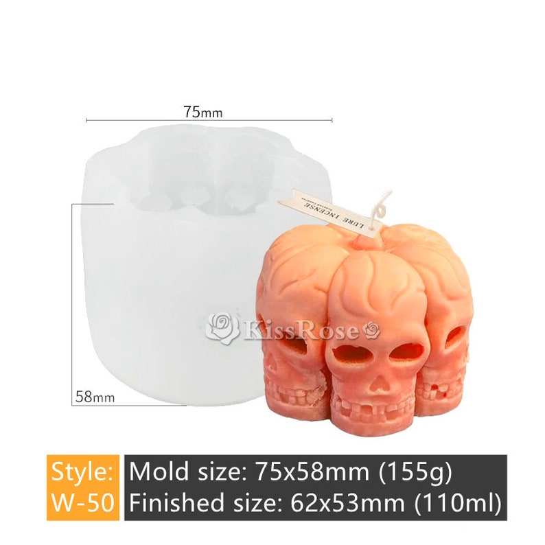 May include: A white silicone mold for making a skull-shaped candle. The mold is 7.5 inches wide and 5.8 inches tall. The finished candle will be 6.2 inches wide and 5.3 inches tall. The mold is shown with a finished candle made of pink wax.