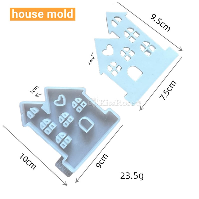 Puede incluir: Un molde de casa de silicona azul con un coraz&oacute;n y ventanas. El molde mide 9,5 cm de alto, 7,5 cm de ancho y 10 cm de largo. Pesa 23,5 gramos.