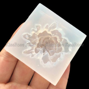 May include: A clear silicone mold with a raised design of a single rose flower. The mold is designed for resin casting.