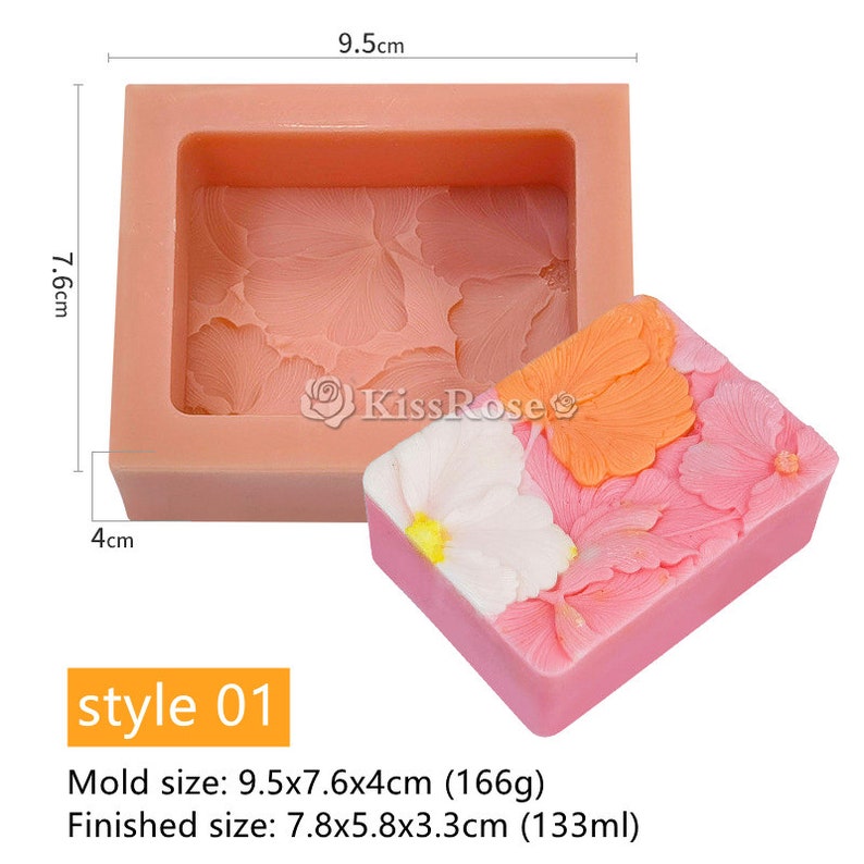 May include: A pink silicone mold for making soap with a floral design. The mold measures 9.5 inches by 7.6 inches by 4 inches. A finished soap bar is shown next to the mold.