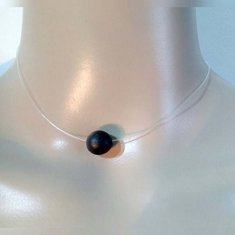 measures 36cm. A Choker necklace made of transparent nylon thread and a beautiful pendant bead black amber scented handmade