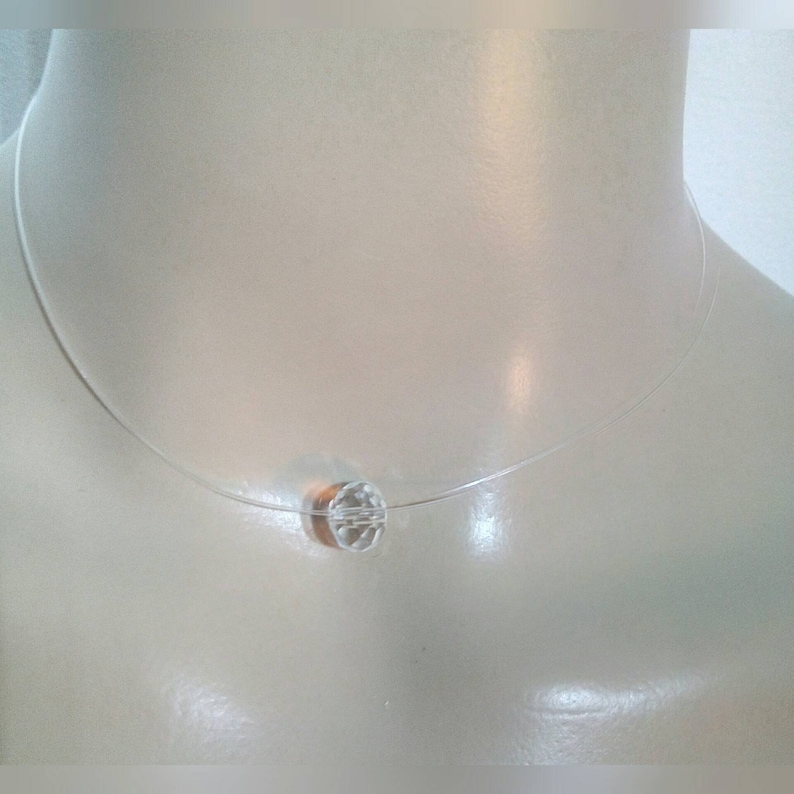 A Choker necklace made with a gorgeous transparent pendant transparent nylon thread Measures 36cm.