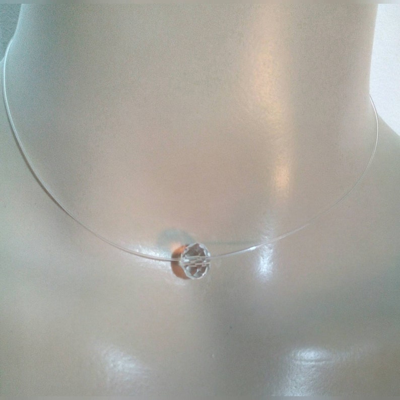 A Choker necklace made with a gorgeous transparent pendant transparent nylon thread Measures 36cm.