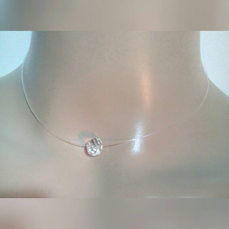 A Choker necklace made with a gorgeous transparent pendant transparent nylon thread Measures 36cm.