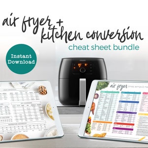 May include: Two digital tablets displaying printable cheat sheets for air fryer cooking conversions. The tablets are on a white countertop with a black air fryer in the background. The text on the tablets reads "air fryer times temps & measures" and "Liquid Conversions, Oven Temperature Conversions, Dry Conversions, Temperature Conversions".