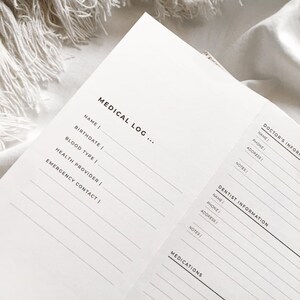 May include: A white medical log page with sections for personal information, doctor's information, dentist information, and medications. The sections include fields for name, phone number, address, and notes.