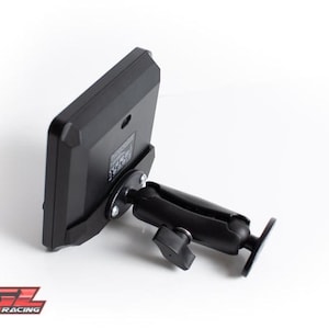May include: A black electronic device with a screen, mounted on a black adjustable arm. The device is angled, showing its back and the mounting hardware. The base has the text "KGL SIM RACING".