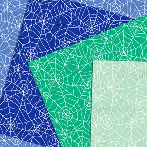 May include: Three sheets of paper with a spiderweb pattern. The sheets are blue, green, and light green.