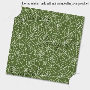 May include: A seamless pattern of white spiderwebs on a dark green background. The webs are intricate and detailed, creating a spooky and festive design.