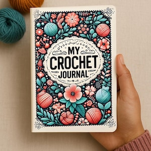 May include: A white journal with a colorful floral design featuring balls of yarn, flowers, and leaves. The title "My Crochet Journal" is printed in black on the front cover.