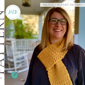 May include: A woman wearing a mustard yellow crocheted infinity scarf. The scarf is crocheted in a simple stitch and is worn around the neck. The woman is smiling and looking to the side. The background is a blurry image of a porch with a rocking chair.