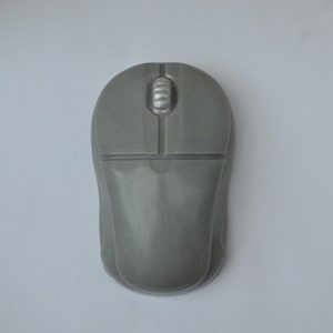 May include: A gray computer mouse with a silver scroll wheel.