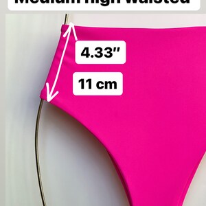 May include: Bright pink high-waisted bikini bottoms. The waist measures 4.33 inches (11 cm) high. The text "Medium high waisted" is displayed above the bikini bottoms.