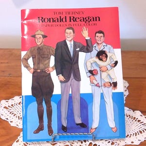 May include: A set of three ceramic mugs with a speckled, matte finish. The mugs are in shades of cream, light brown, and dark brown. Each mug has a simple, minimalist design and a rounded handle.