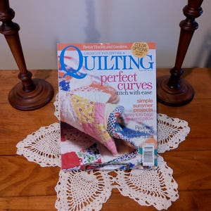 May include: A set of three ceramic mugs with a speckled, matte finish. The mugs are in shades of cream, light gray, and dark gray. Each mug has a simple, minimalist design, perfect for coffee or tea.