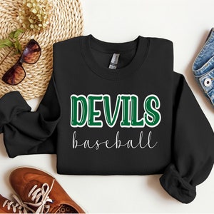 May include: Black sweatshirt with the text "DEVILS baseball" in green and white lettering.