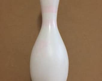 One plain white craft bowling pin