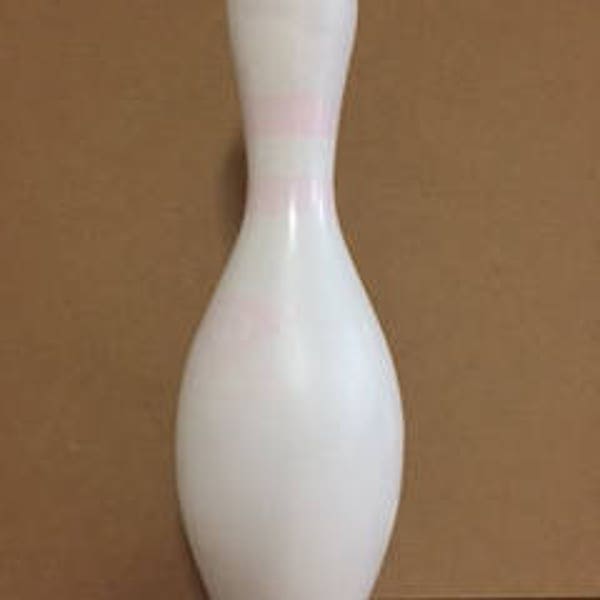 One plain white craft bowling pin