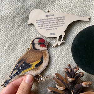 Goldfinch wooden decoration - illustrated bird keepsake with symbolism on the back