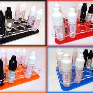 May include: A clear acrylic organizer with 12 round slots for holding bottles. The organizer is available in four colors: black, red, orange, and blue.