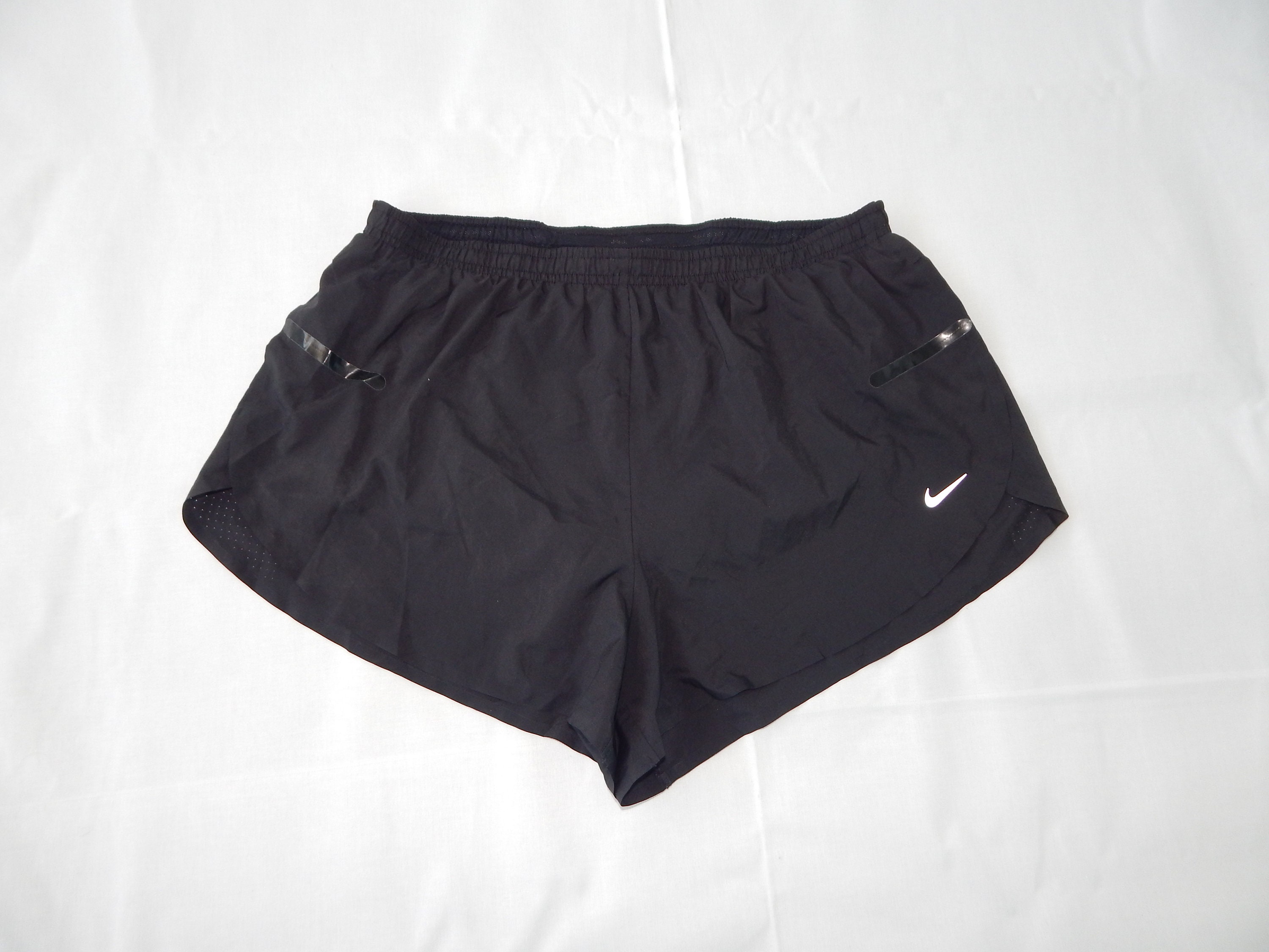 Solid black nike shorts deals