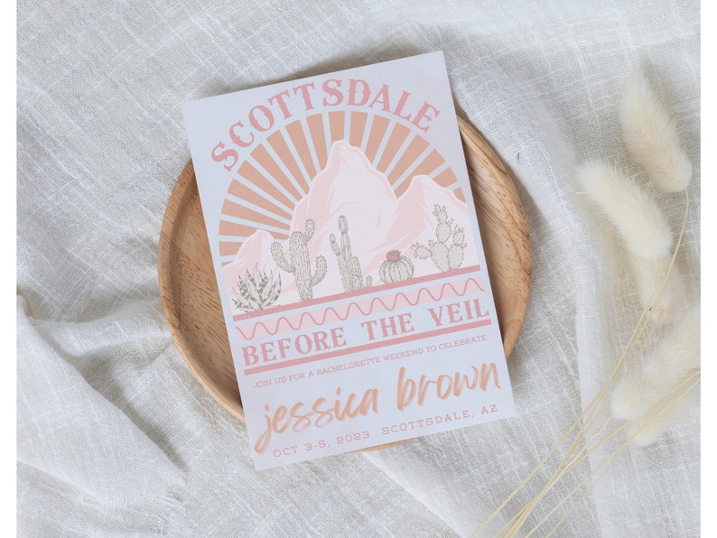 May include: A pink and white illustrated invitation for a bachelorette party in Scottsdale, Arizona. The invitation features a desert landscape with mountains, cacti, and a sunset. The text reads "Scottsdale Before the Veil Join us for a bachelorette weekend to celebrate Jessica Brown Oct 3-5, 2023 Scottsdale, AZ"