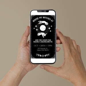 May include: A black and white mobile phone screen displaying a witch-themed hen party invitation. The invitation reads "Where my witches at" and includes details about the event, such as the date, time, and location. The invitation features a graphic of two hands holding a crescent moon.