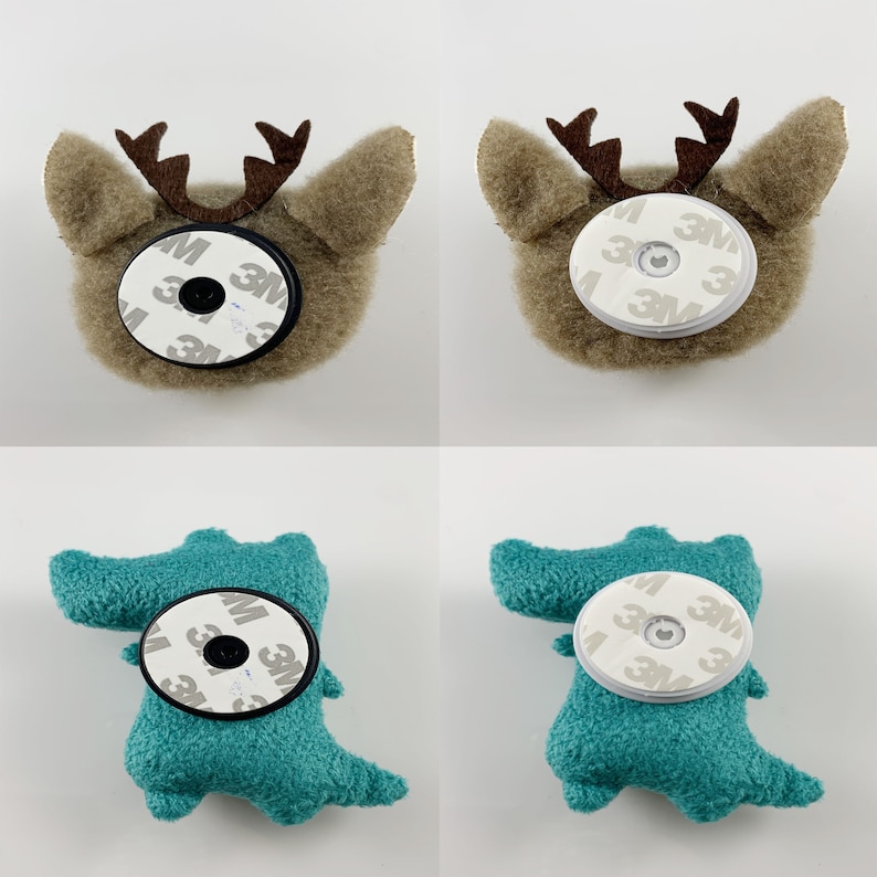 May include: Four plush toys, two reindeer and two alligators, each with a round, white sticker on their backs. The stickers have the 3M logo and the words "3M" printed on them.