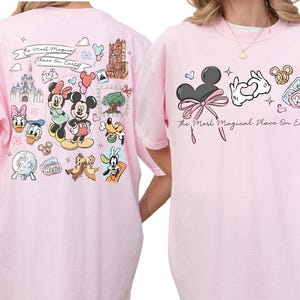 two pink t-shirts with Disney characters and various Disney-themed illustrations.