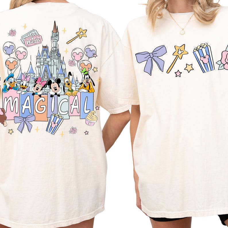 two white t-shirts with Disney characters and the word "MAGICAL" printed on them.
