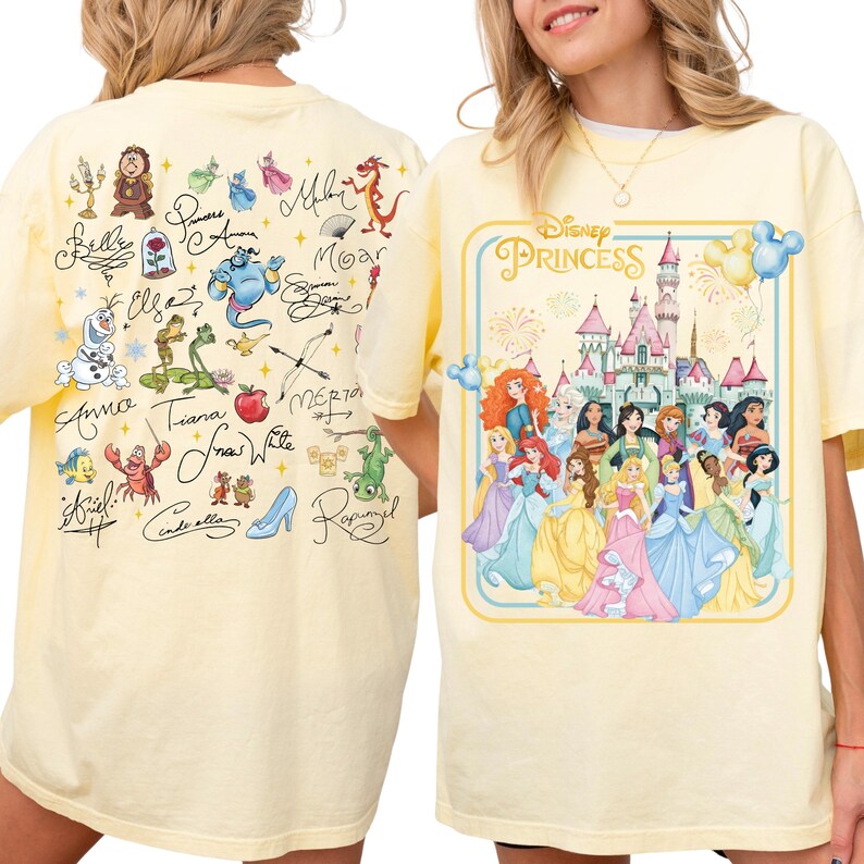 a yellow t-shirt with a Disney Princess graphic and various Disney characters on the back.