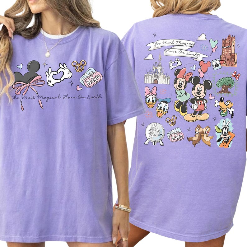 A woman wearing a purple t-shirt with various Disney characters and Disney-themed graphics printed on it.