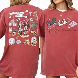 two red t-shirts with Disney-themed designs, including Minnie Mouse, Mickey Mouse, Donald Duck, Goofy, and other iconic Disney characters.