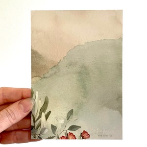 May include: A rectangular watercolor art print with a soft, muted color palette. The design features a blend of earthy tones, including beige, olive green, and brown, with floral accents in the lower left corner and the text "Sentimental Studio Pink Cockatoo" in the lower right corner.