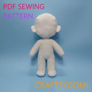 May include: A white plush doll body with arms, legs, and ears, set against a blue background. The text "PDF SEWING PATTERN" is displayed in pink and purple, and the text "CRAFTSYGOMI" is in orange.