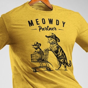 Meowdy パートナー。カウボーイ猫シャツ。彼女へのギフト。猫の飼い主へのギフト。彼へのギフト