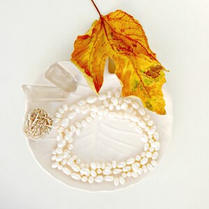 women's sautoir necklace with white baroque cultured pearls in a romantic boho spirit
