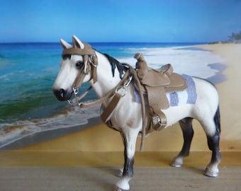 Western saddle set in Schleich size light leather