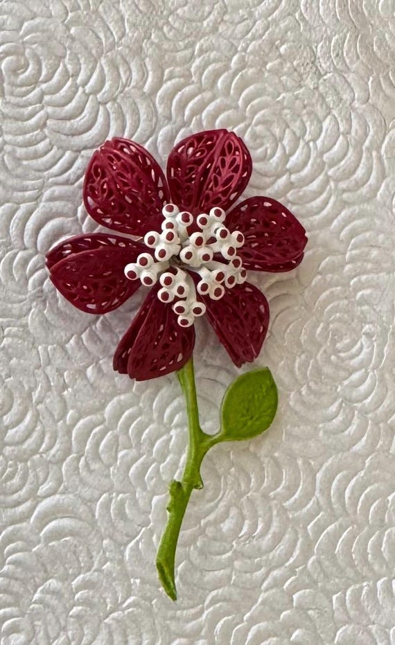 Unique vintage celluloid flower brooch