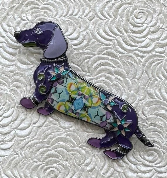 A jewelled gold dachshund brooch by Cartier A jewelled gold dachshund brooch by Cartier