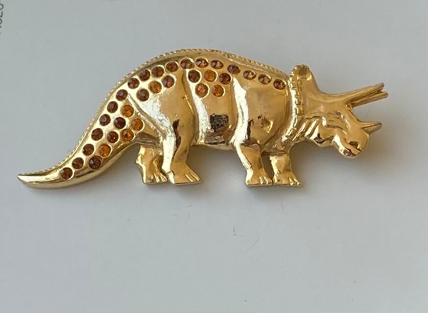Dinosaur brooch discount