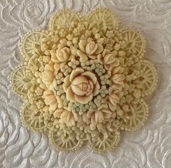 Unique vintage celluloid flower brooch