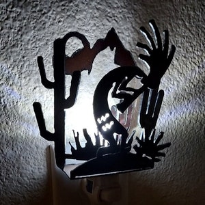 Kokopelli Night Light made out of Rusted Steel Multi-layer desert scene