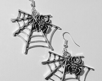Large spiderweb silver plated earrings.