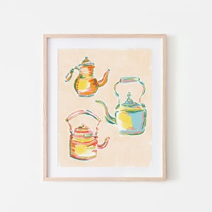 May include: A framed illustration of three colorful teapots. The teapots are drawn in a whimsical style with bright colors and details. The background is a light beige.