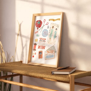 May include: A framed illustration of vintage sewing supplies, including spools of thread, buttons, scissors, a thimble, a tape measure, and a pattern for a dress. The illustration is in a watercolor style and features a red, white, and blue color scheme.