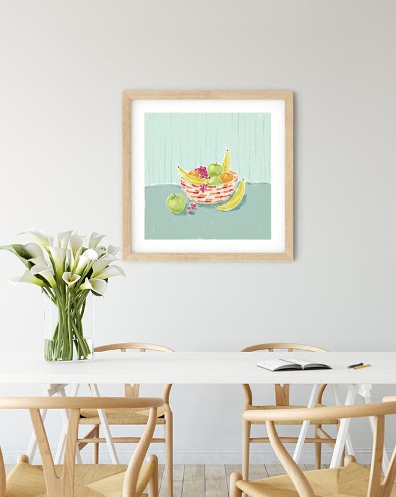 May include: A framed illustration of a bowl of fruit on a light blue background. The bowl is filled with bananas, apples, and oranges. The bowl is red and white with a striped pattern.