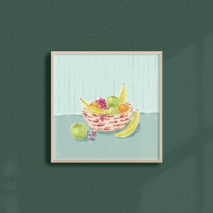 May include: A red and white striped bowl filled with fruit, including bananas, apples, and oranges. The bowl is sitting on a light blue surface.